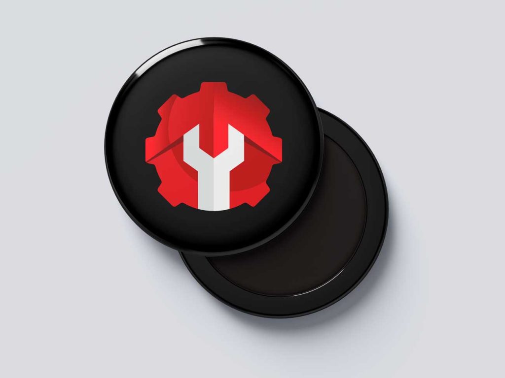 Badge med logo til industrivirksomhed, der viser tandhjul og skruenøgle, ideelt til at promovere brandet.